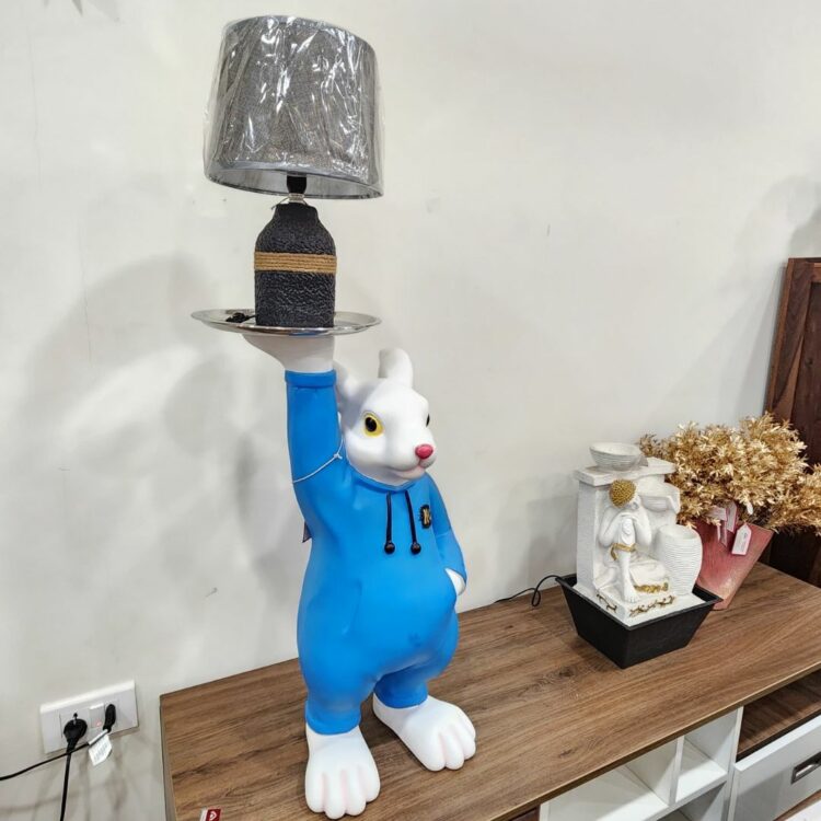 MK_10_Blue_Color_Dressed_Rabbit_Holding_A_Table_Lamp_Side_View