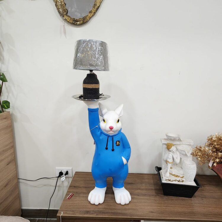 MK_10_Blue_Rabbit_Holding_A_Table_Lamp